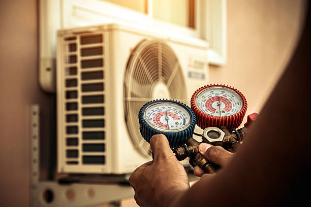 Professional Air Conditioning Service technician working in Union Mills, IN